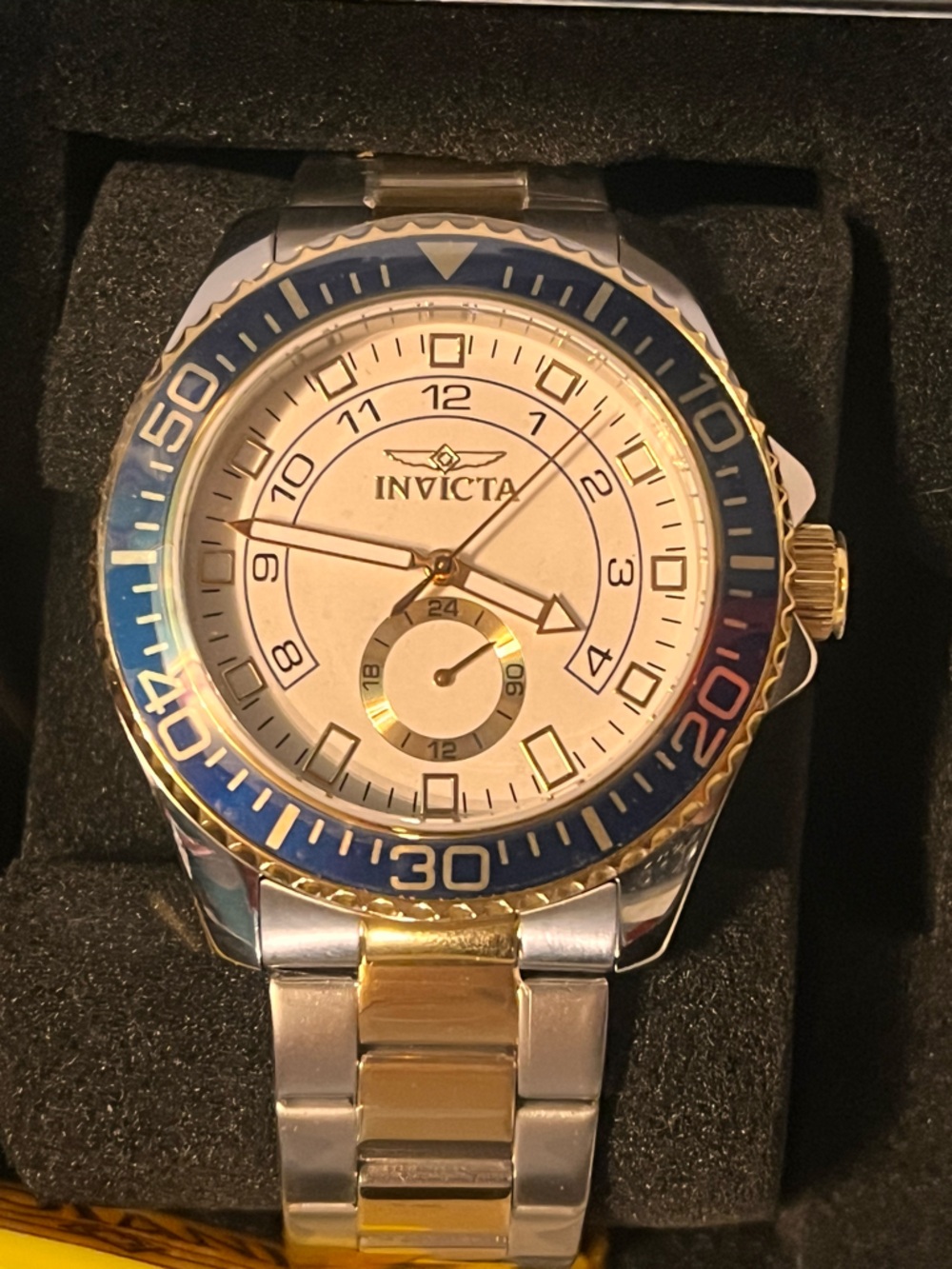 Invicta Two-Tone Watch with Blue Bezel and White Dial